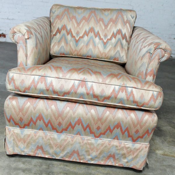 Tuxedo Style Skirted Lounge Chair with Rolled Arms and Flame Stitch Upholstery