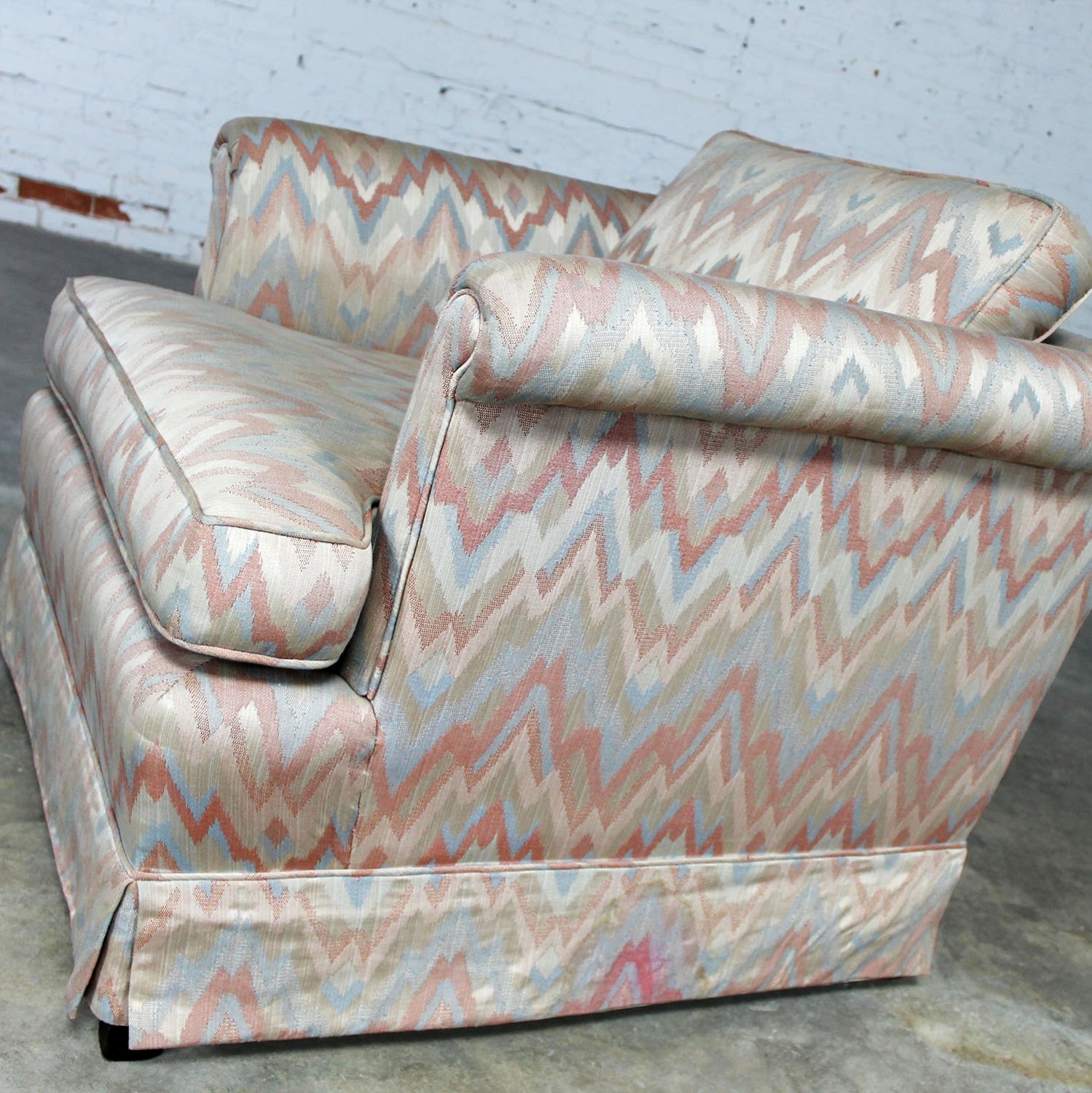 Tuxedo Style Skirted Lounge Chair with Rolled Arms and Flame Stitch Upholstery