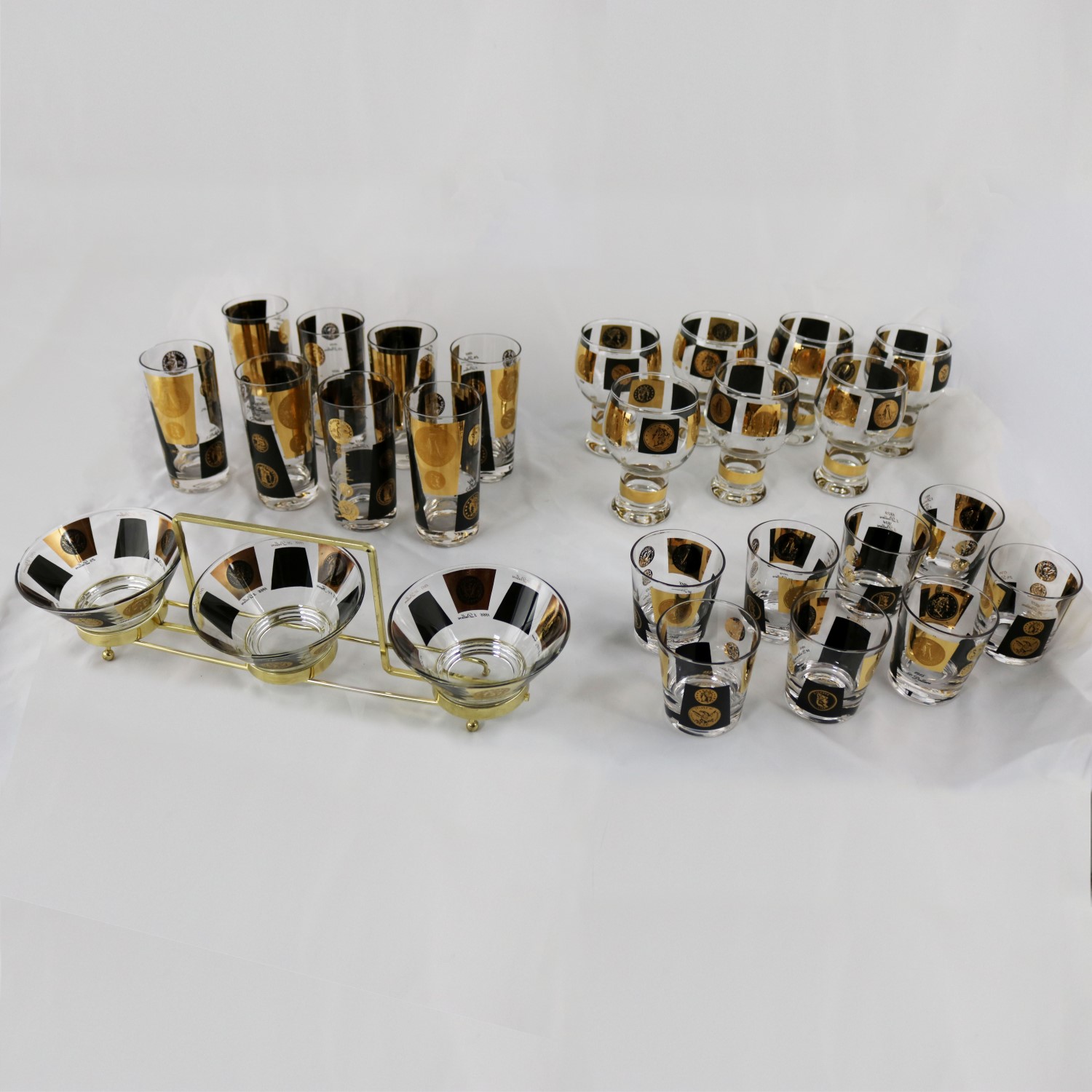 Extensive Set of 22-Karat Gold and Black Coin Barware and Glasses by Cera Mid Century Modern