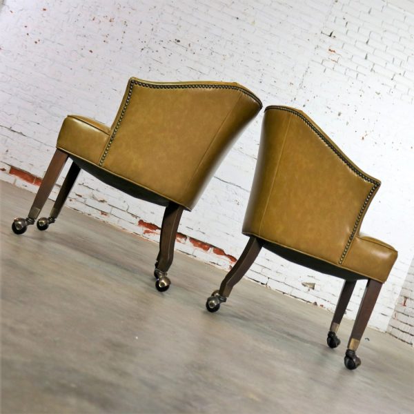 Pair of Mid Century Naugahyde Olive Green Rolling Barrel Chairs with Nail Head Accent