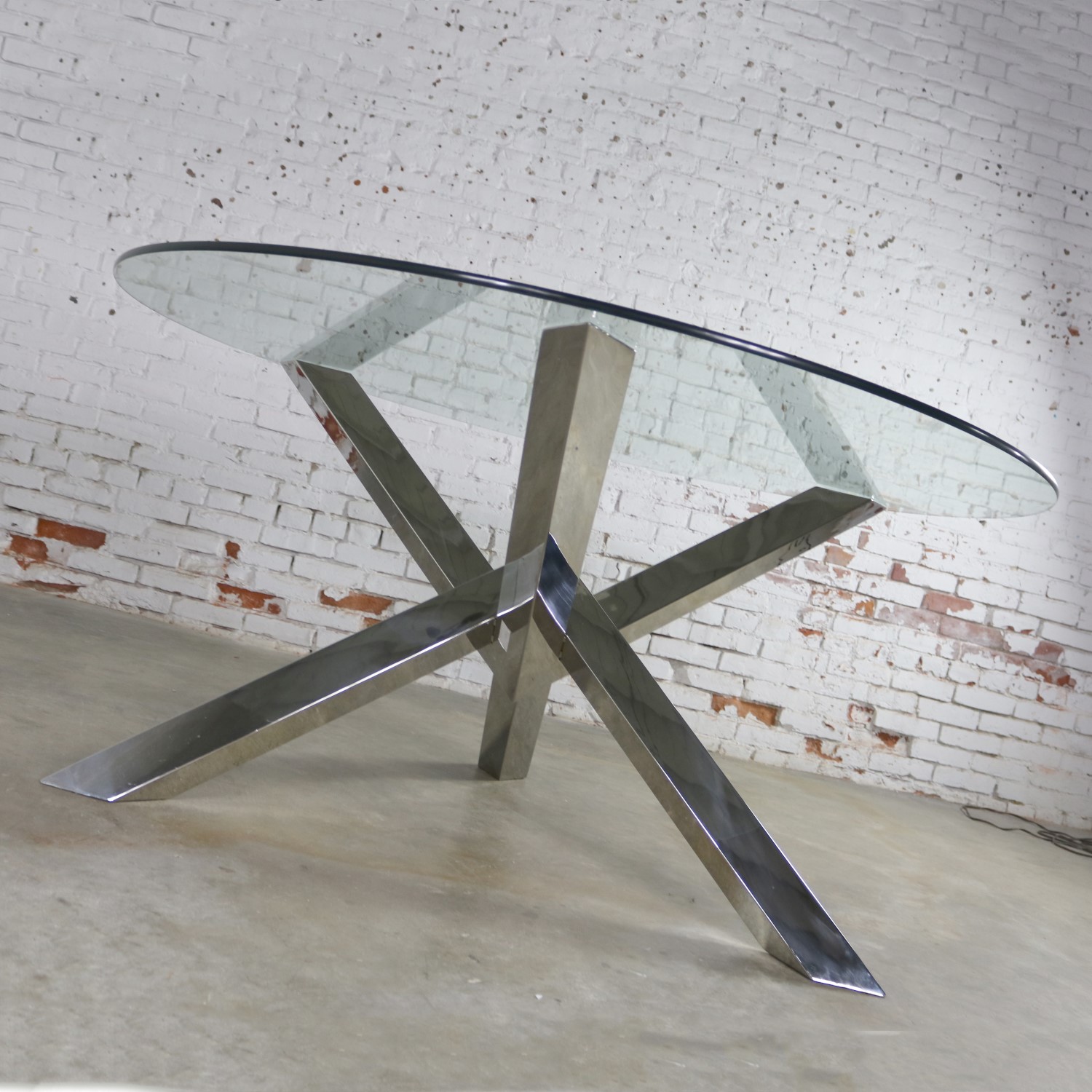 Nuevo Costa Round Stainless-Steel Jacks Style Dining Table with Glass Top
