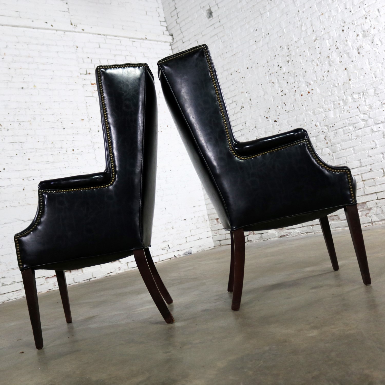 Black Naugahyde Art Deco Hollywood Regency Wingback Chairs with Nailhead Detail a Pair