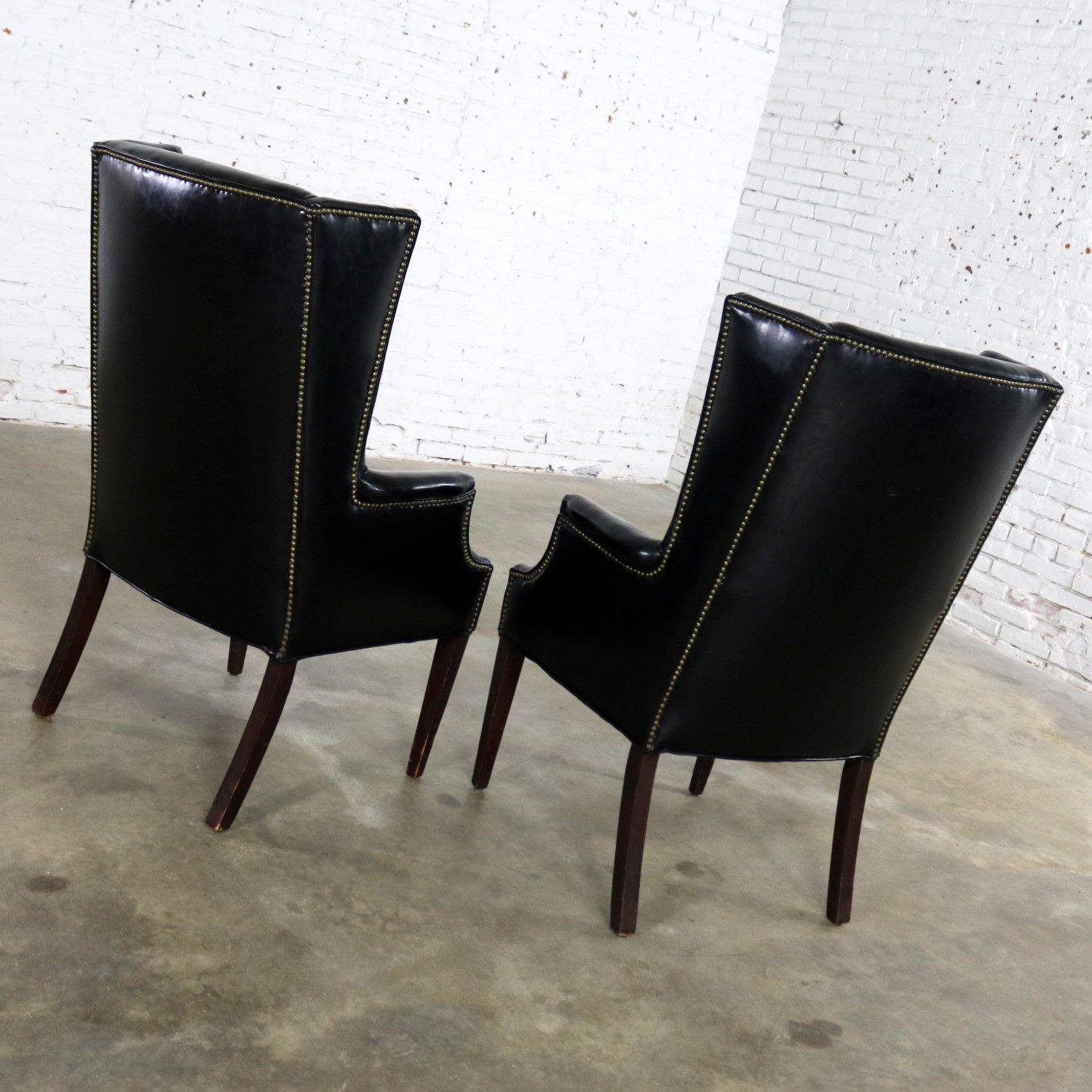 Black Naugahyde Art Deco Hollywood Regency Wingback Chairs with Nailhead Detail a Pair