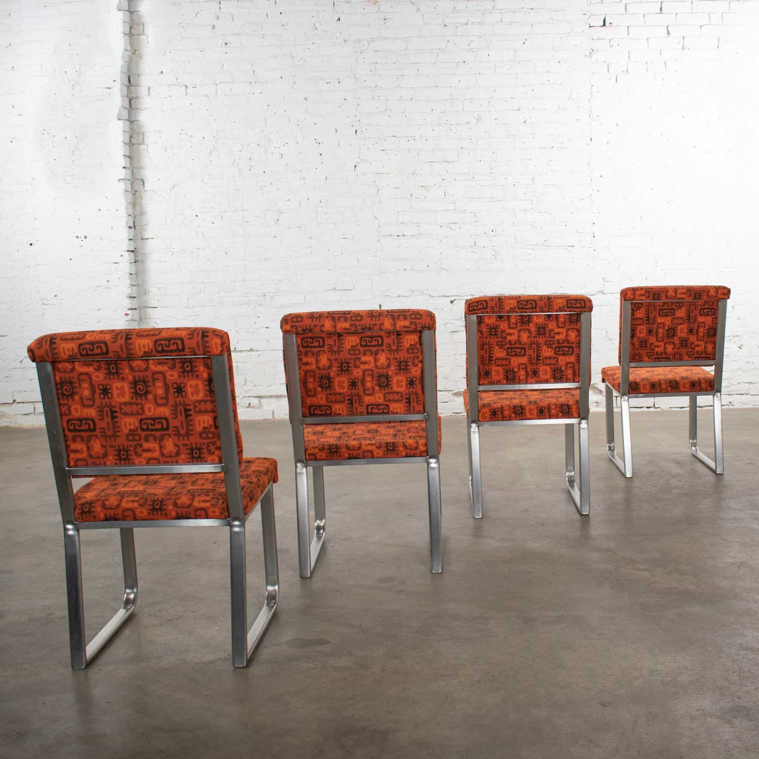 4 Streamline Modern Railroad Dining Car Chairs in Stainless Steel & Orange Abstract Upholstery