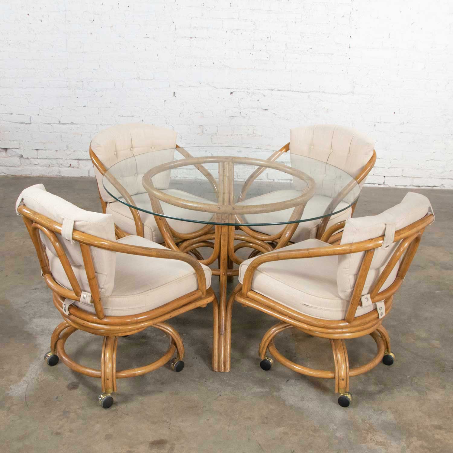 Vintage Rattan Game Table Set Round Glass Top Table & 4 Swivel Rolling
