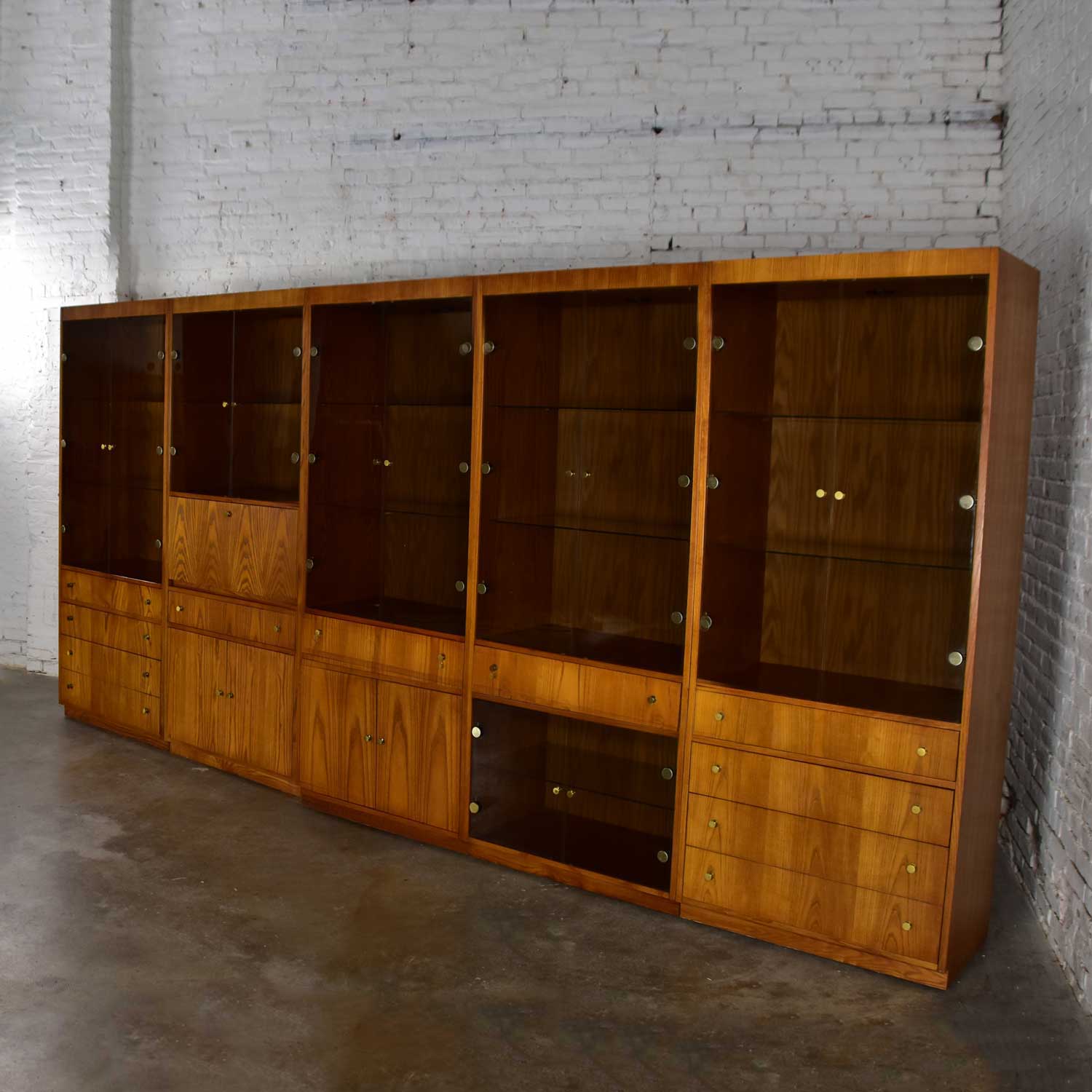 MCM Hooker 5 Section Oak Veneer Display Cabinet Wall Unit with Smoked Glass Doors and Brass Pulls