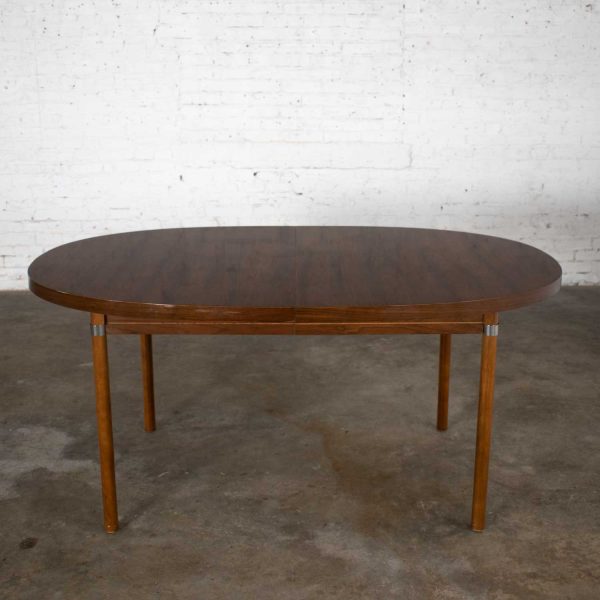 MCM Oval Walnut Toned Expanding Dining Table with Chrome Accents and Wood Grain Laminate Top