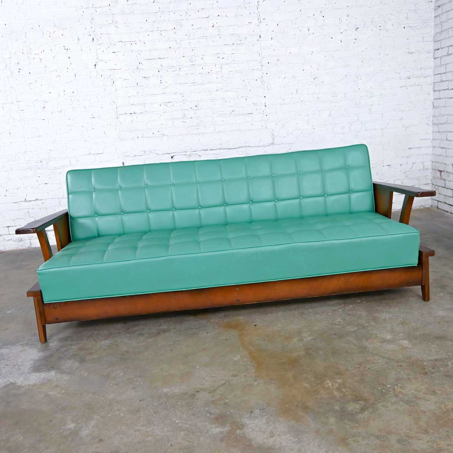 A Brandt Ranch Oak Style Turquoise Vinyl Convertible Sofa Daybed by Economy Furniture