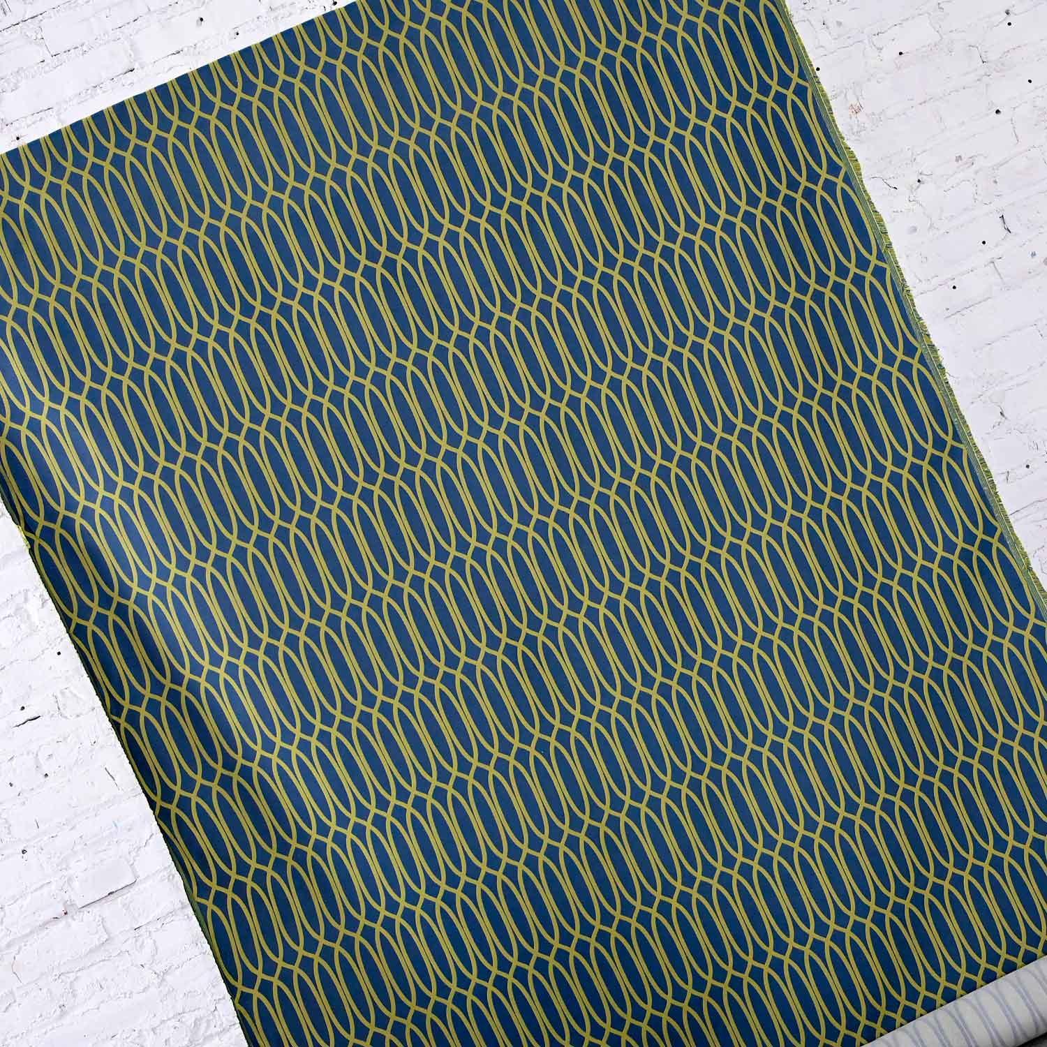 Gorgeous mid-century modern to modern style geometric blue and green Flection Plunge fabric bolt by Momentum Textiles. Beautiful condition. There is some soiling on the reverse of the fabric but does not show through to the front. Please see photos and zoom in for details. We attempt to portray any imperfections. Circa, 2016 NOTE: We have several items listed here that would look awesome reupholstered in this gorgeous fabric by Momentum Textiles!!