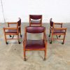 Mid-Century Modern to Modern Oak Maroon Vinyl Rolling Game or Dining Chairs