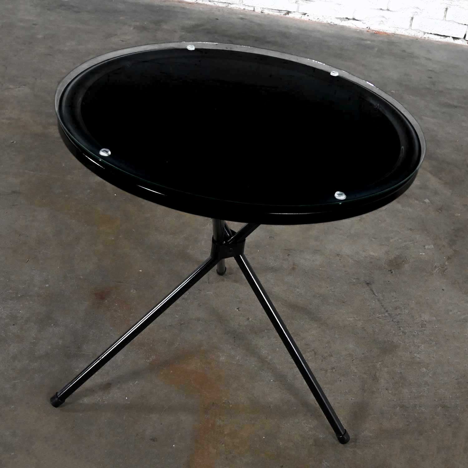 Mid to Late 20th Century MCM Round Metal Outdoor Black Painted Tripod Accent Table with Glass Top