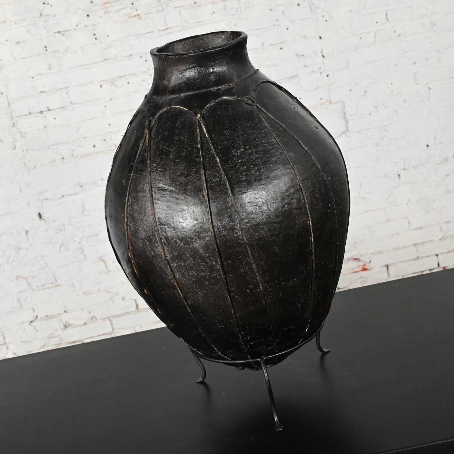 20th Century Tribal Large Scale Clay Fermenting Pot or Water Jug Black w/ Goatskin Leather Straps on Stand