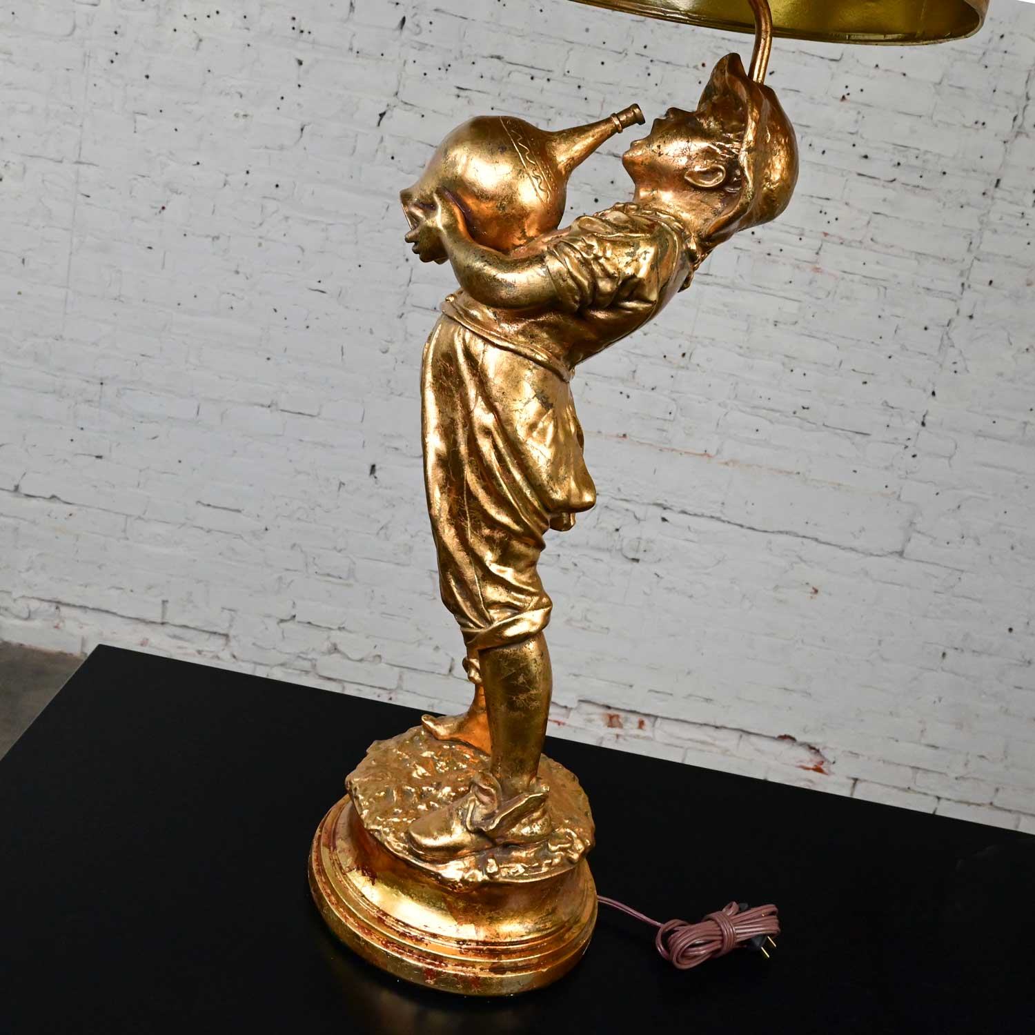 Mid Century Hollywood Regency Gilded Plaster Large Scale Figural Lamps Boy with Jug Style Marbro, a Pair