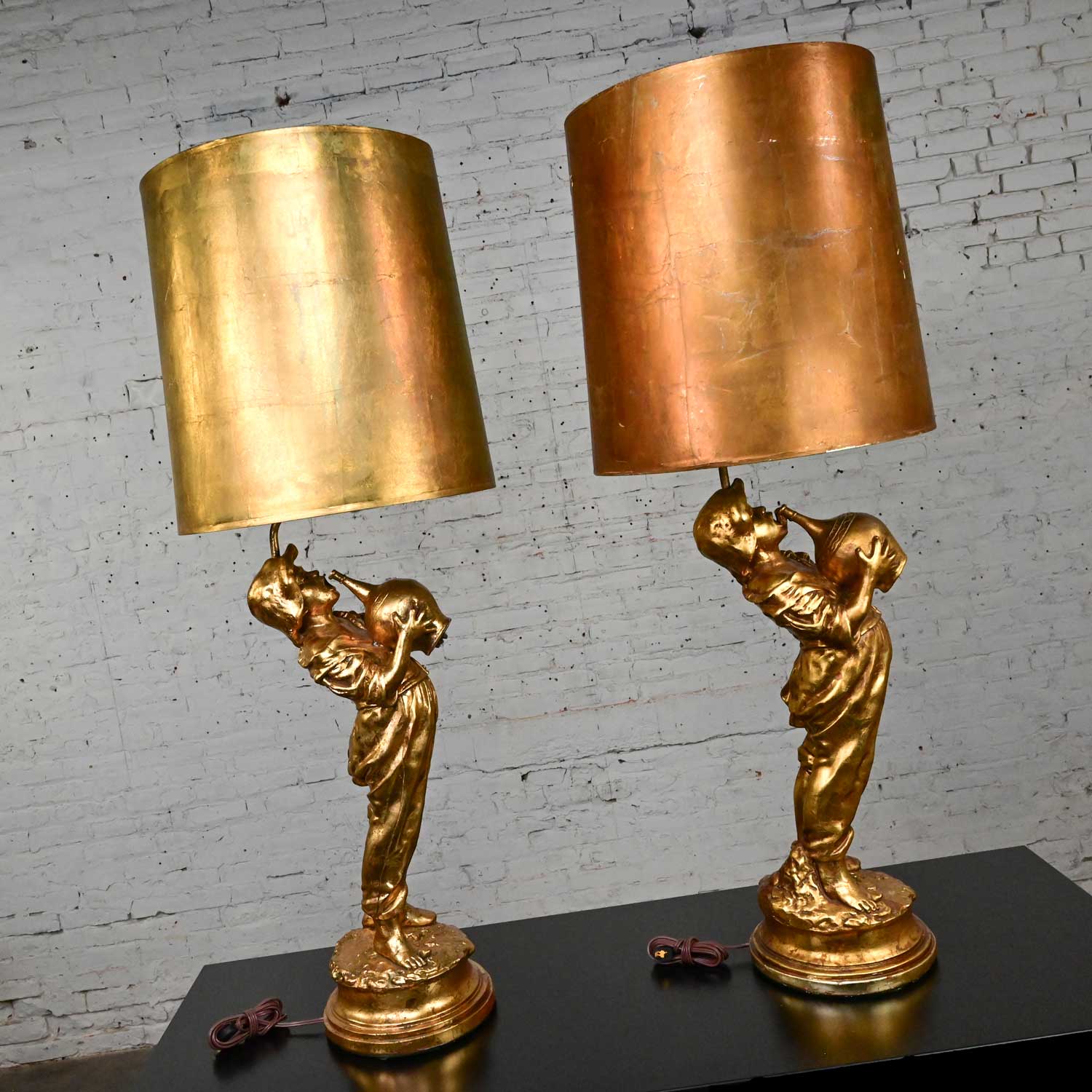 Mid Century Hollywood Regency Gilded Plaster Large Scale Figural Lamps Boy with Jug Style Marbro, a Pair