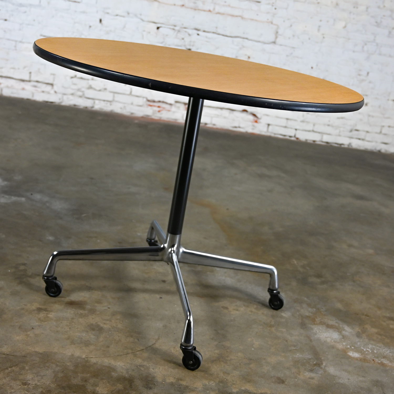Vintage MCM Eames for Herman Miller Table Aluminum Universal Base with Black Casters & 36” Round Blonde Laminate Top