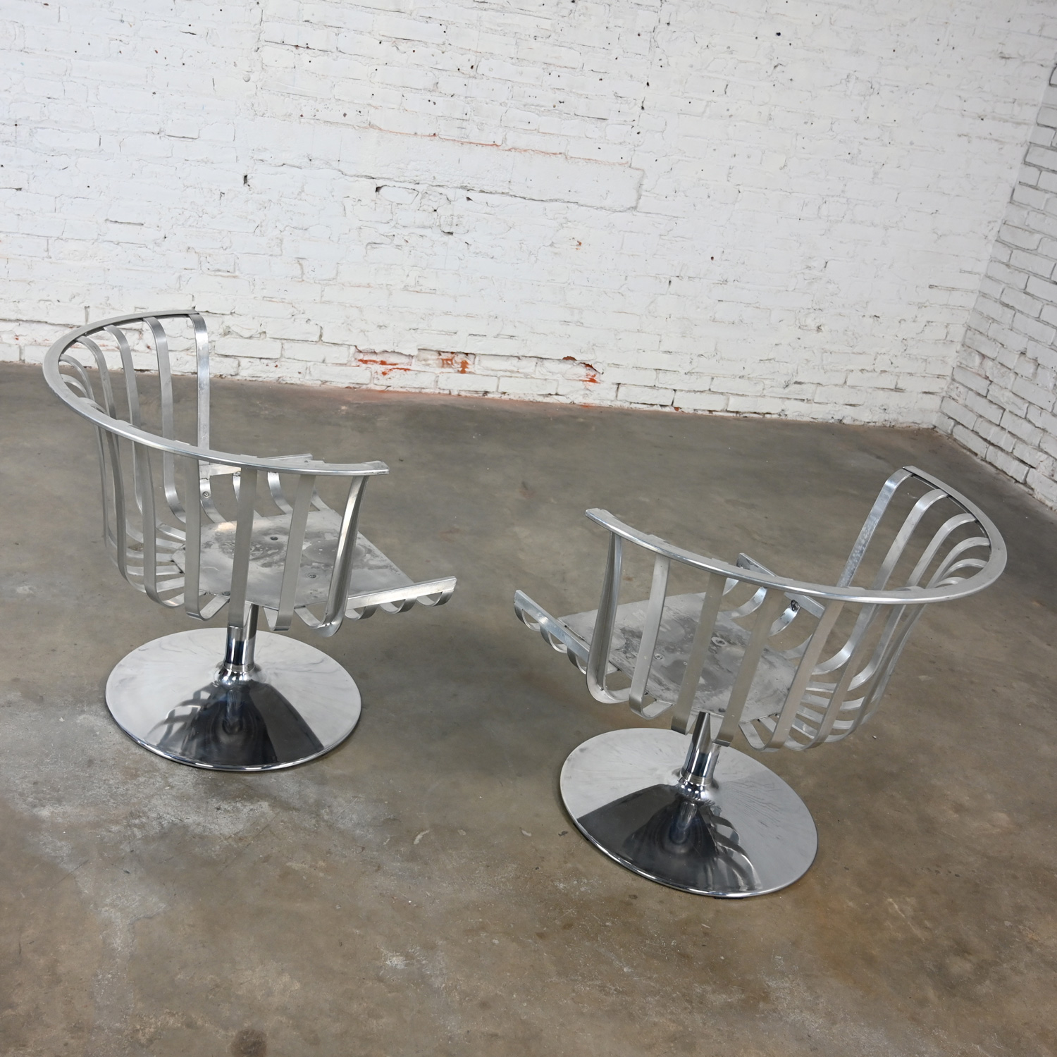 1960’s MCM Polished Aluminum Barrel Swivel Lounge Chairs with Chrome Tulip Base by Russell Woodard a Pair