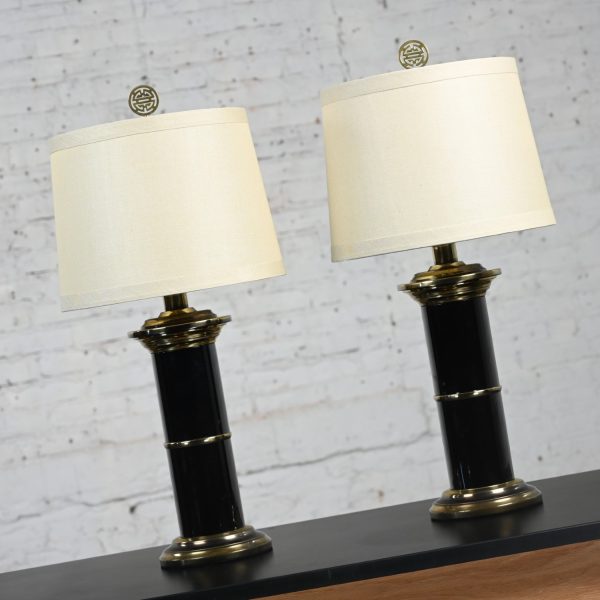 Late 20th Century Hollywood Regency Black & Brass Plated Column Table Lamps with Asian Finials a Pair