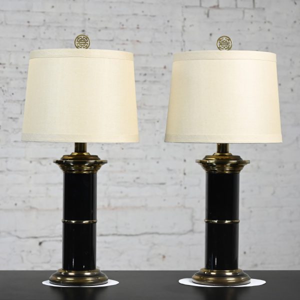 Late 20th Century Hollywood Regency Black & Brass Plated Column Table Lamps with Asian Finials a Pair