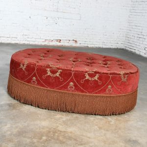 Late 20th Century Traditional to Transitional Large Oval Cocktail Ottoman Rust Colored Fabric Bullion Fringe Trim