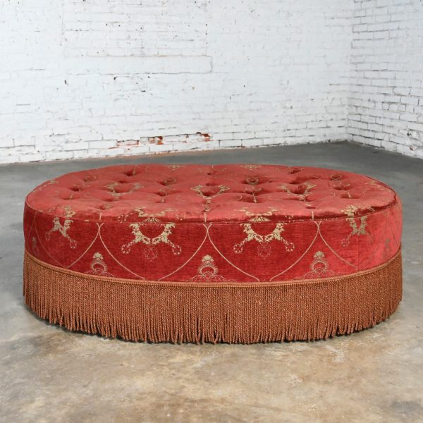 Late 20th Century Traditional to Transitional Large Oval Cocktail Ottoman Rust Colored Fabric Bullion Fringe Trim