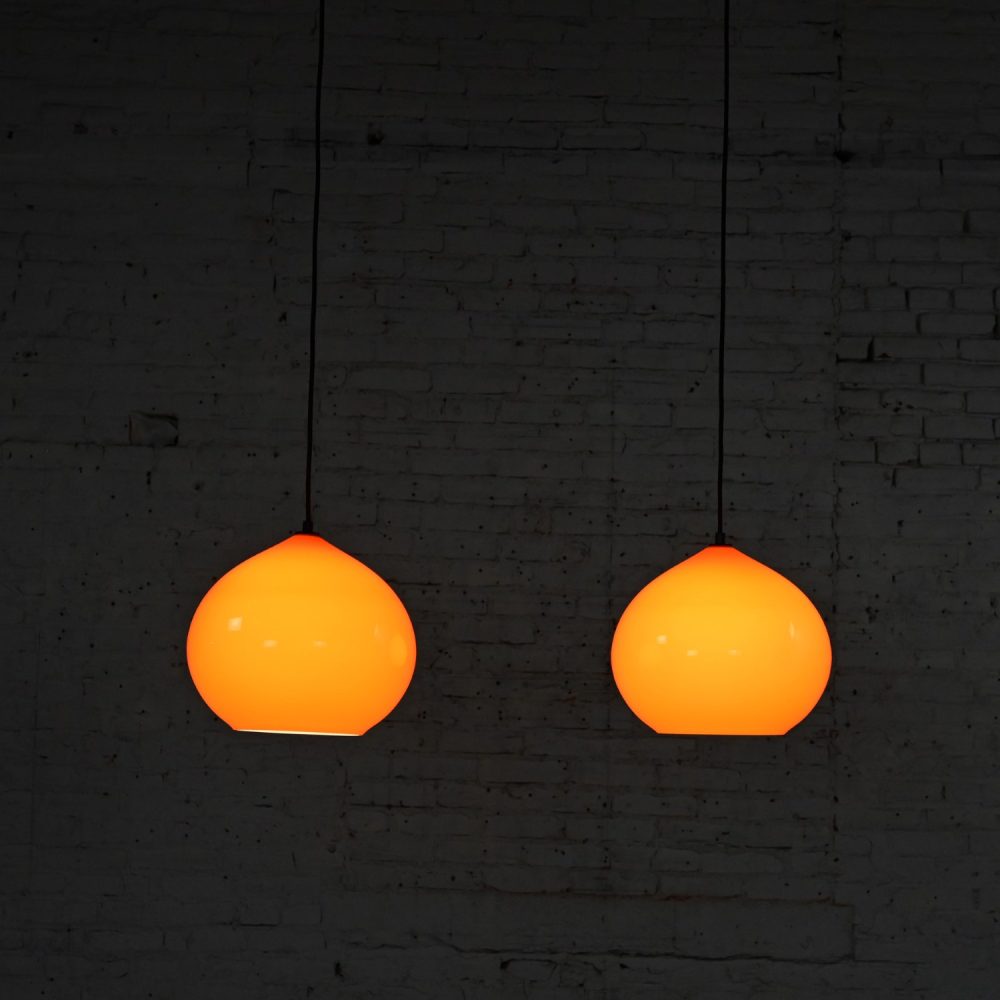 Mid Century Modern Italian Orange Cased Murano Glass Pendant Lights Attributed to Alessandro Pianon for Vistosi