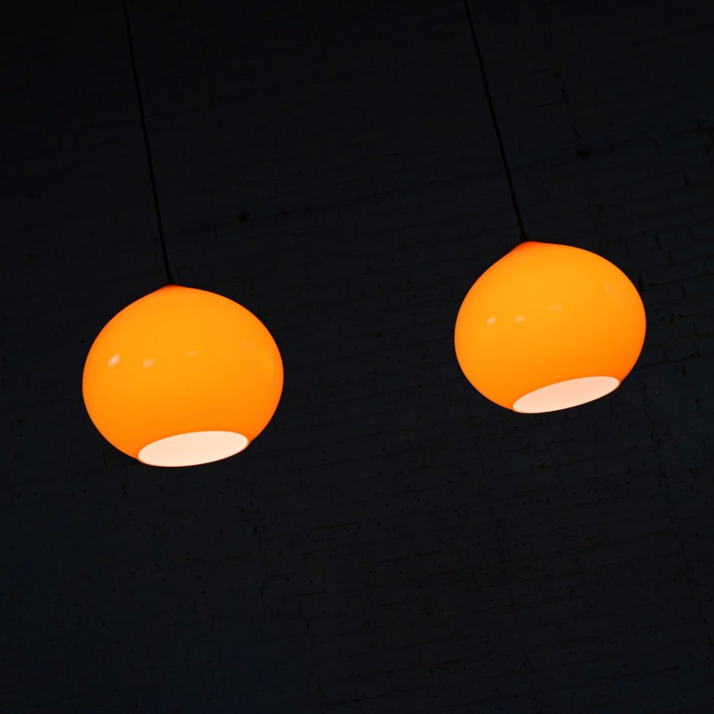 Mid Century Modern Italian Orange Cased Murano Glass Pendant Lights Attributed to Alessandro Pianon for Vistosi