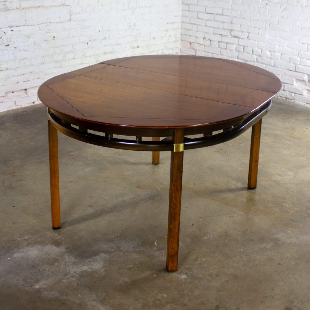 Mid-20th Century MCM to Campaign Style Round to Oval Expanding Dining Table Attributed to Tung Si Collection by Hickory Manufacturing