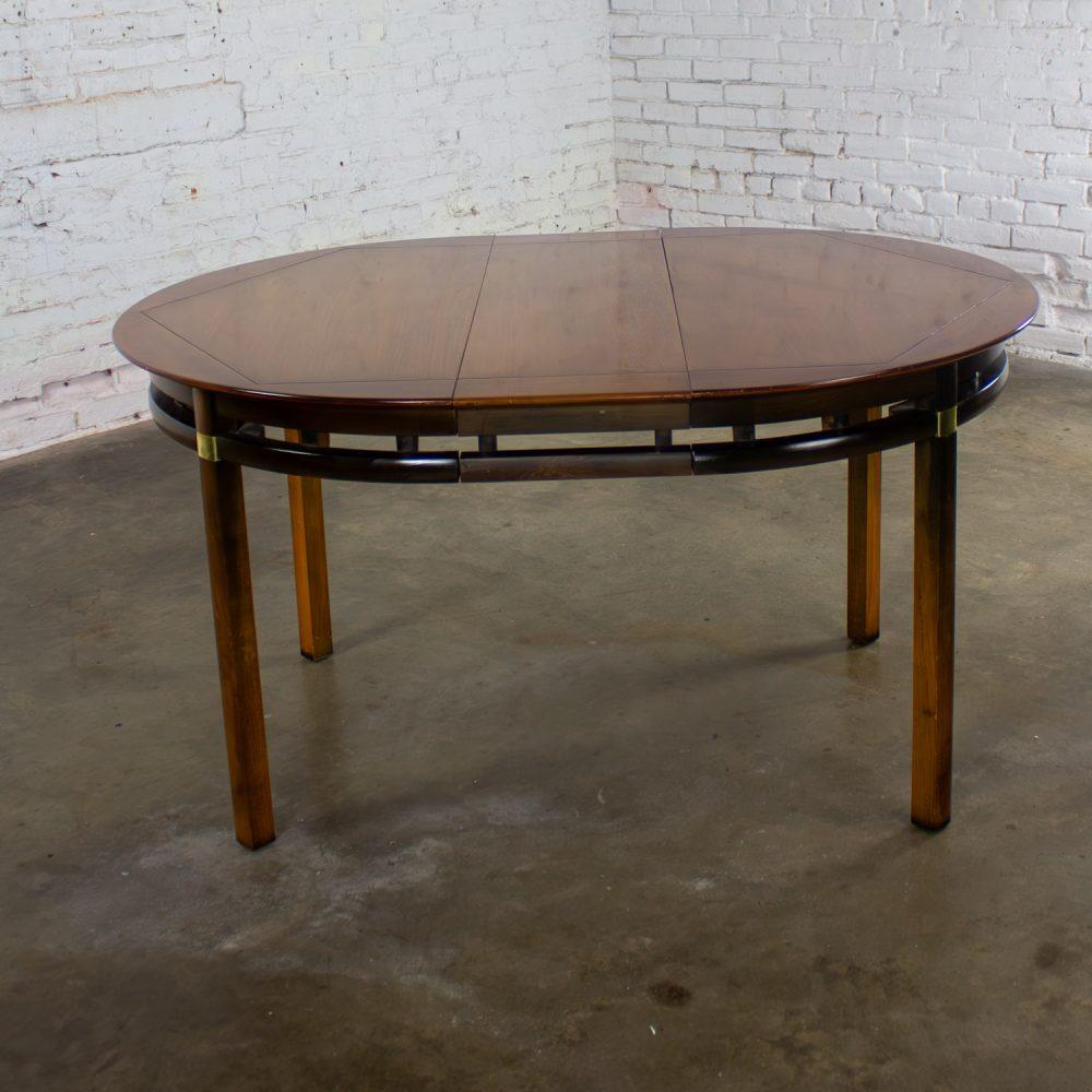 Mid-20th Century MCM to Campaign Style Round to Oval Expanding Dining Table Attributed to Tung Si Collection by Hickory Manufacturing