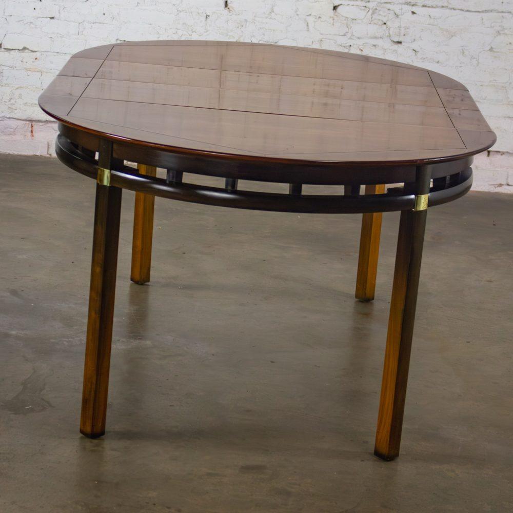 Mid-20th Century MCM to Campaign Style Round to Oval Expanding Dining Table Attributed to Tung Si Collection by Hickory Manufacturing