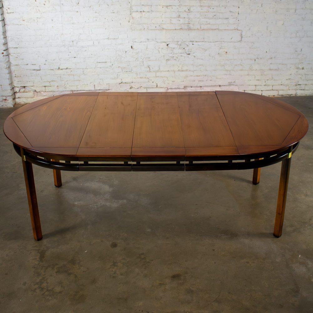 Mid-20th Century MCM to Campaign Style Round to Oval Expanding Dining Table Attributed to Tung Si Collection by Hickory Manufacturing