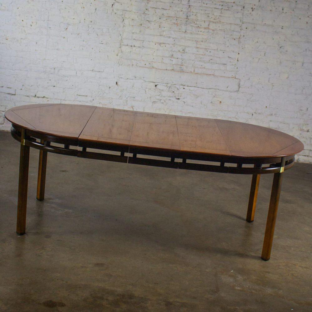 Mid-20th Century MCM to Campaign Style Round to Oval Expanding Dining Table Attributed to Tung Si Collection by Hickory Manufacturing