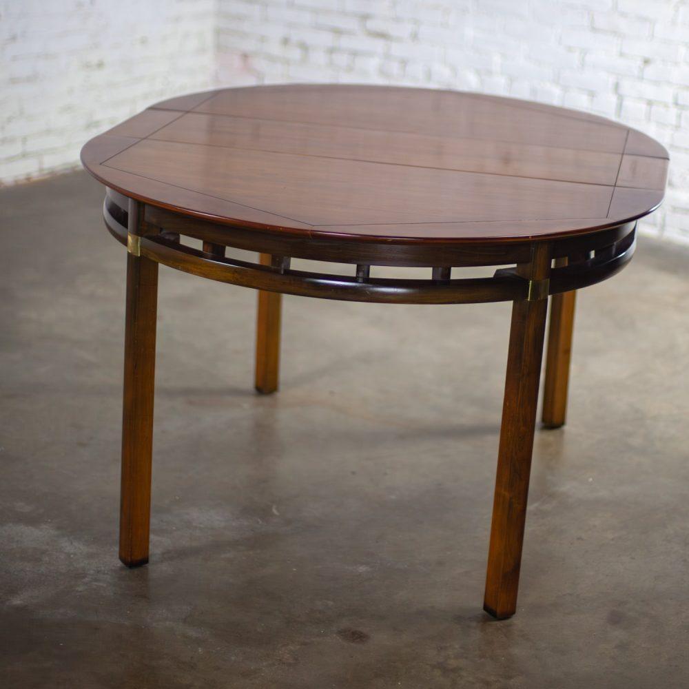 Mid-20th Century MCM to Campaign Style Round to Oval Expanding Dining Table Attributed to Tung Si Collection by Hickory Manufacturing