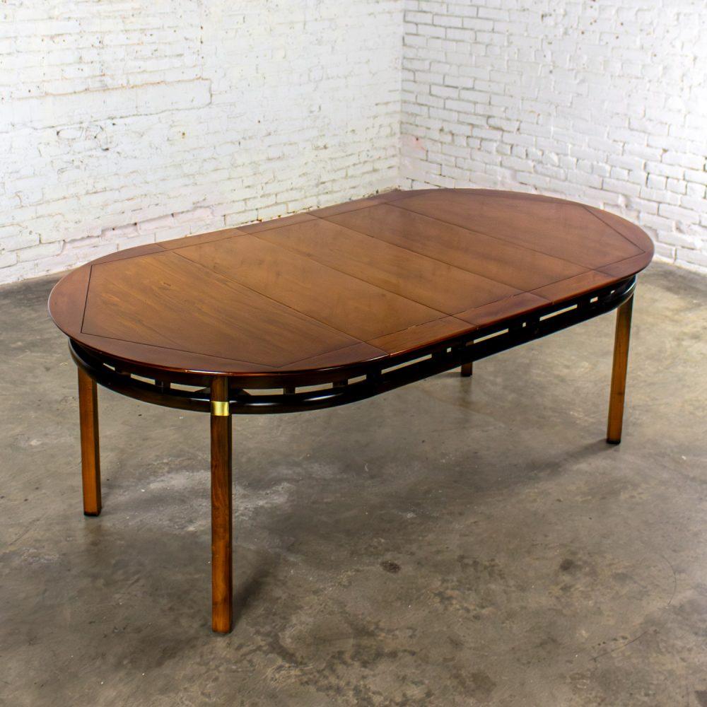 Mid-20th Century MCM to Campaign Style Round to Oval Expanding Dining Table Attributed to Tung Si Collection by Hickory Manufacturing